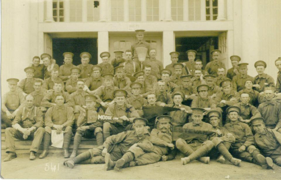 46th Battalion - S. T .  Hampson holding pennant